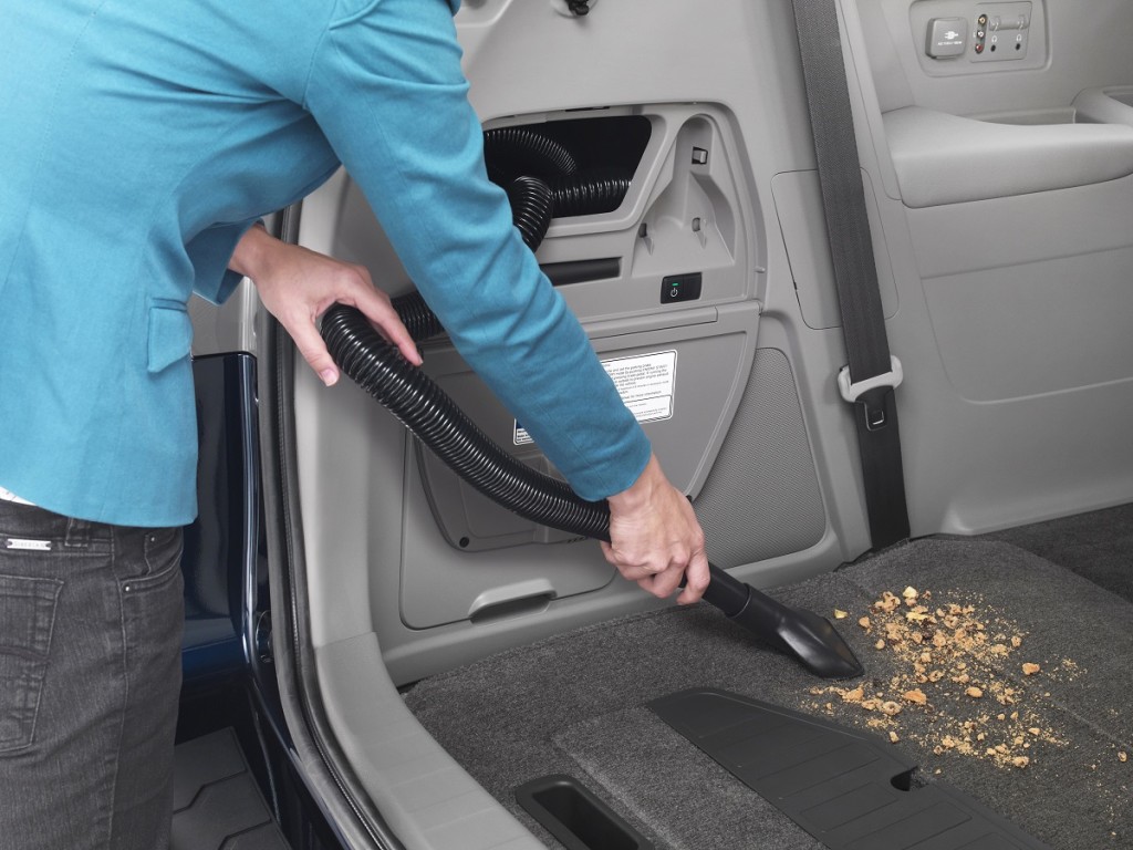 This product image provided by Honda Motor Co. shows the built-in vacuum cleaner featured on the 2014 Honda Odyssey Touring Elite. Honda Motor Co. showed off its updated Odyssey minivan Tuesday evening, March 26, 2013 ahead of the New York International Auto Show. The 2014 Odyssey  which was last redesigned in 2011  has a richer, more chiseled look, chrome-trimmed fog lights and other premium features. (AP Photo/Honda Motor Co.)