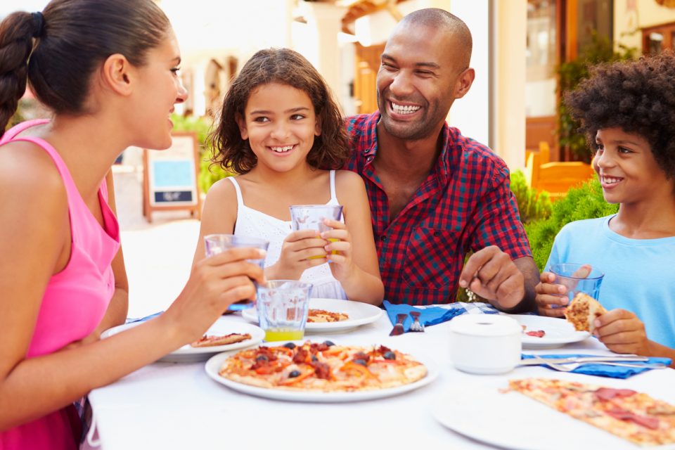 Family eating a meal at a outdoor restaurants