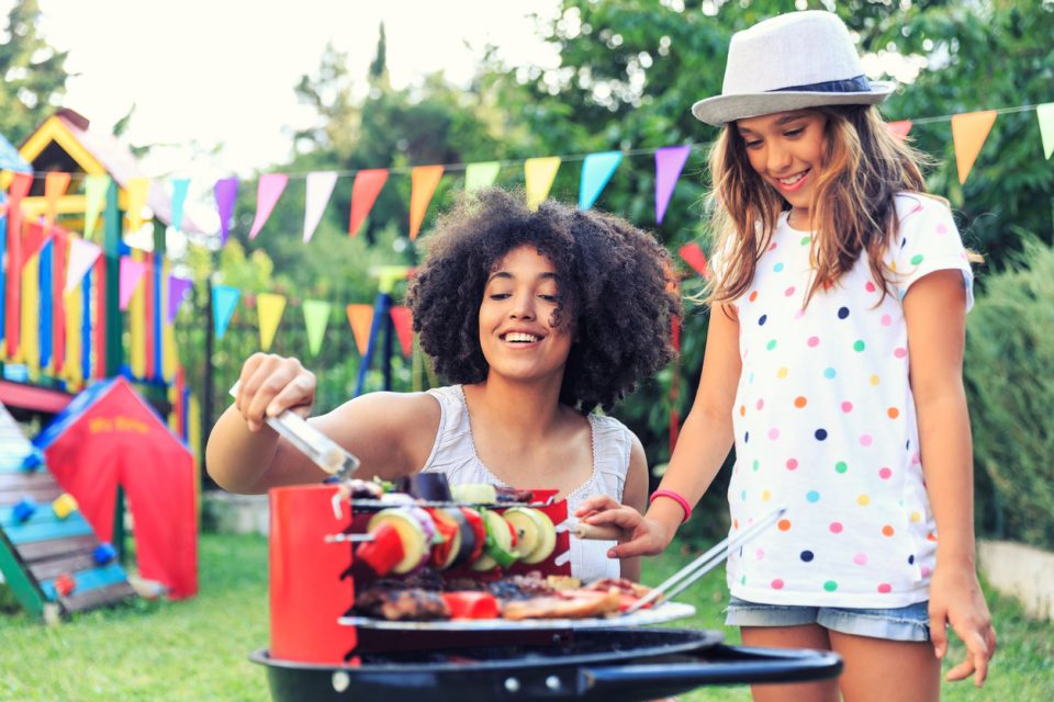 Having fun with mom at a backyard barbecue