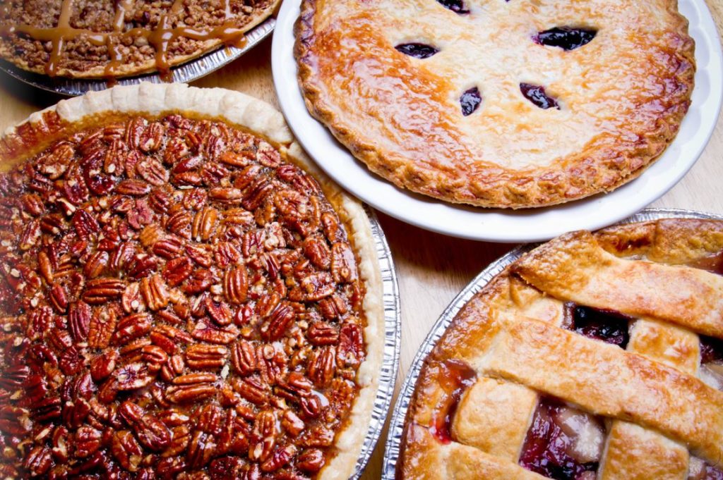 Apple caramel, apple berry, pecan and blueberry pies