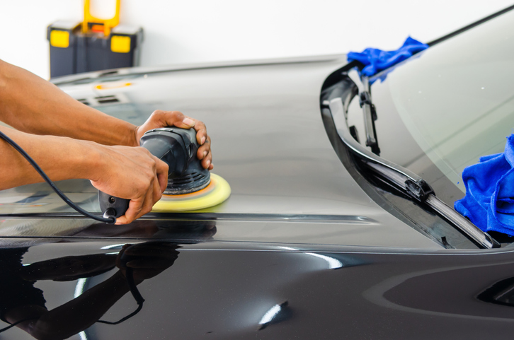 Man working for polishing, coating cars.